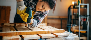 Woman using power drill 